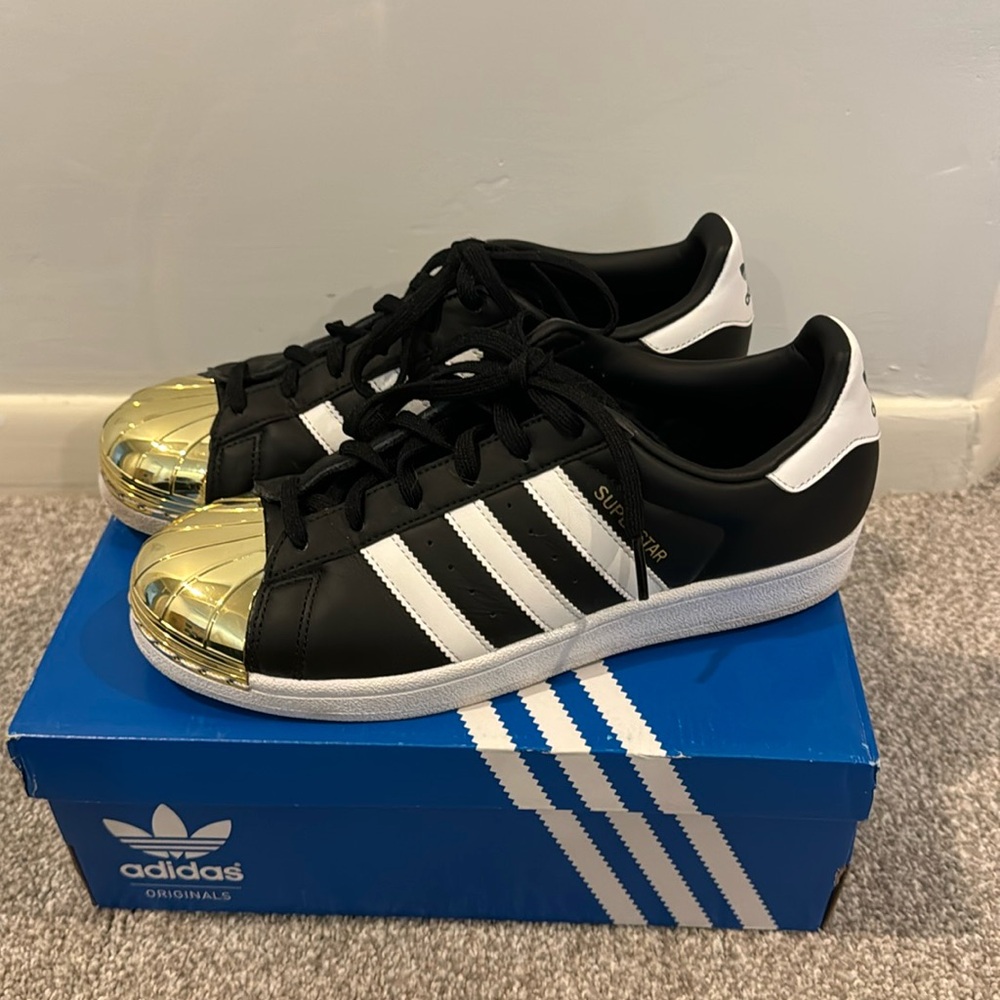 Gold metal cap toe adidas sneakers